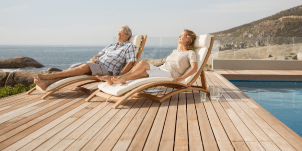 Man and Woman Relaxing in Deck Chairs