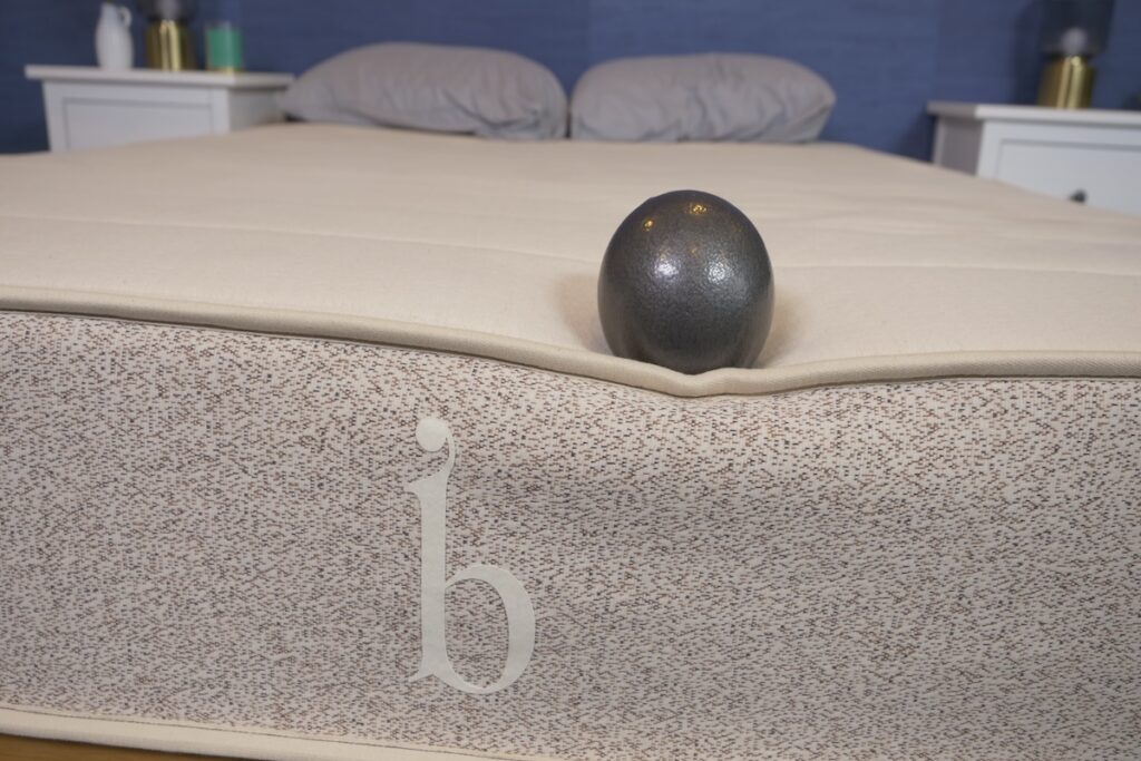 A 10-pound ball near the edge of a Birch mattress to showcase strong edge support.