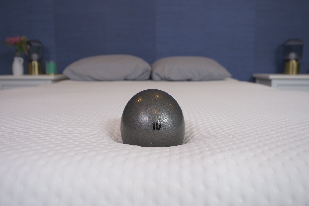 A 10-pound ball rests on the Emma Hybrid Comfort to test bounce.