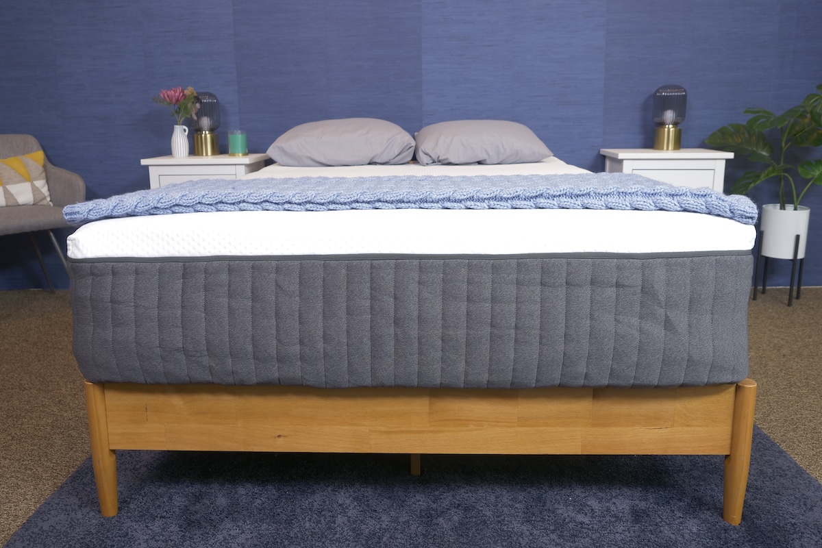 The Emma Hybrid Comfort Mattress on a wooden bed frame 