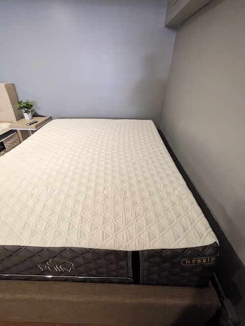 The Puffy Royal Hybrid mattress on an adjustable bed frame