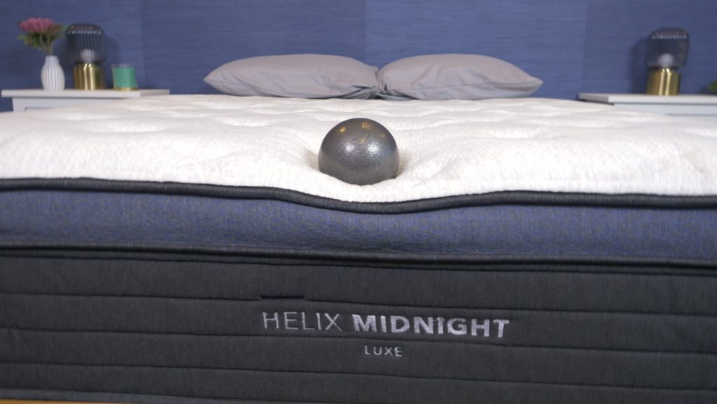 Our tester uses a bowling ball to test the responsiveness and bounce of the Helix Midnight Luxe.
